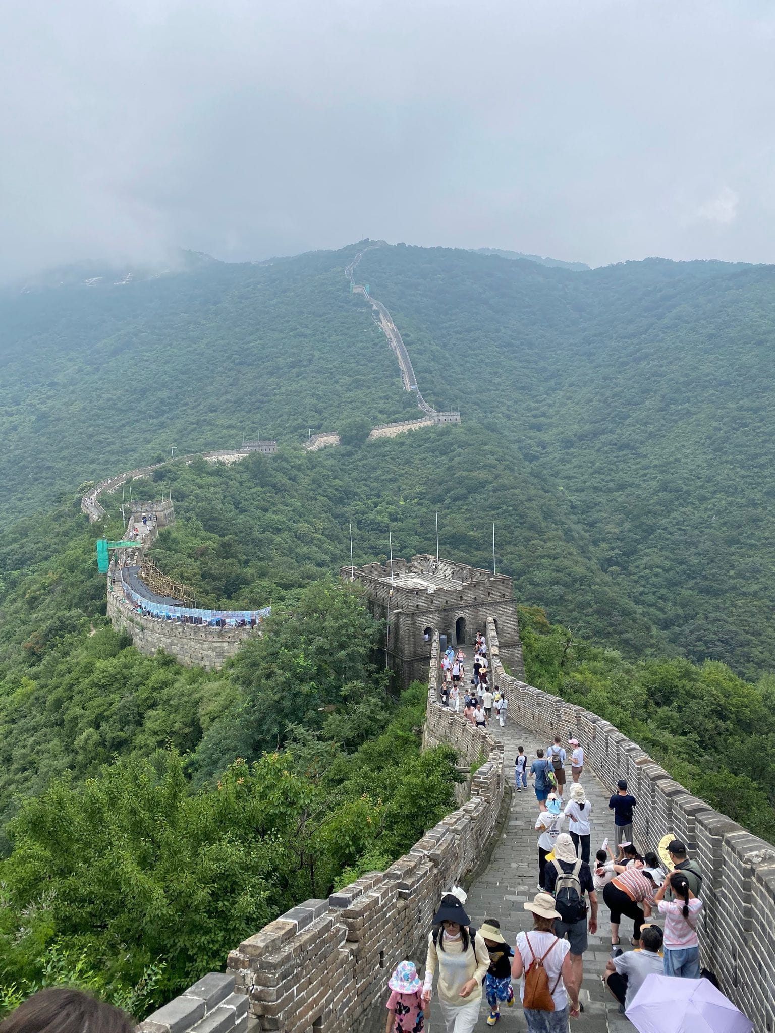 The Great Wall at Mutianyu in summer haze, crowded steps