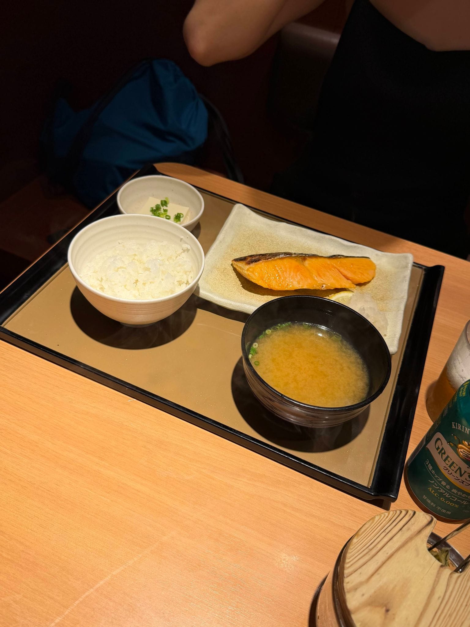 A Japanese set meal tray with rice, miso soup and grilled salmon