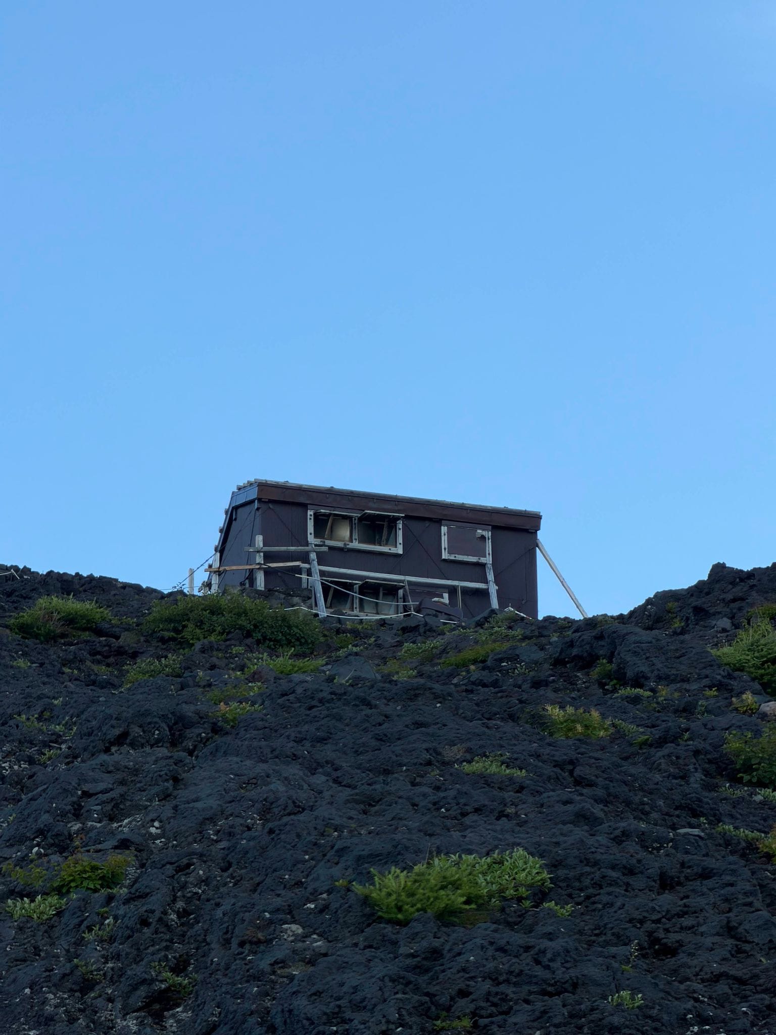 A mountain hut on the black volcanic scree above the tree line
