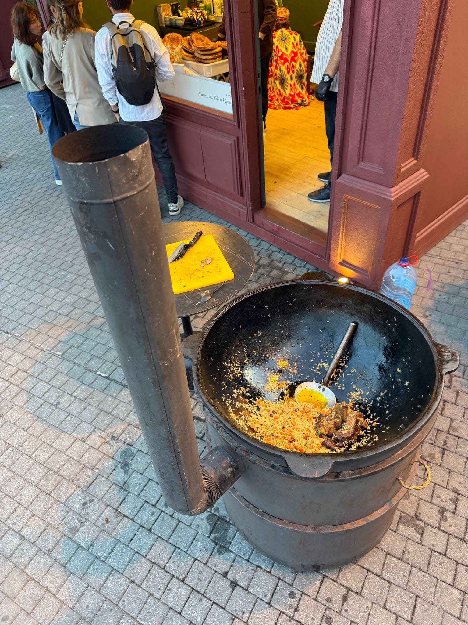 Pilaf in a big kazan on a wood-fired stove at a festival in Baku's Old City