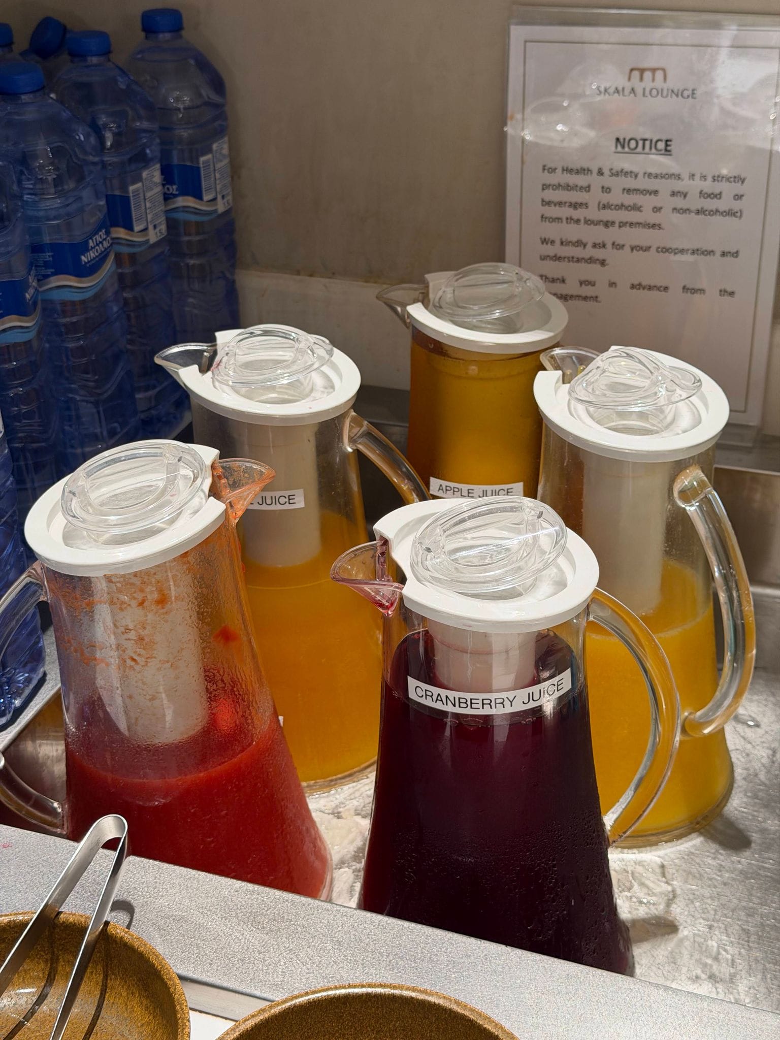 Juice jugs on the counter at the SKALA Lounge, Larnaca airport